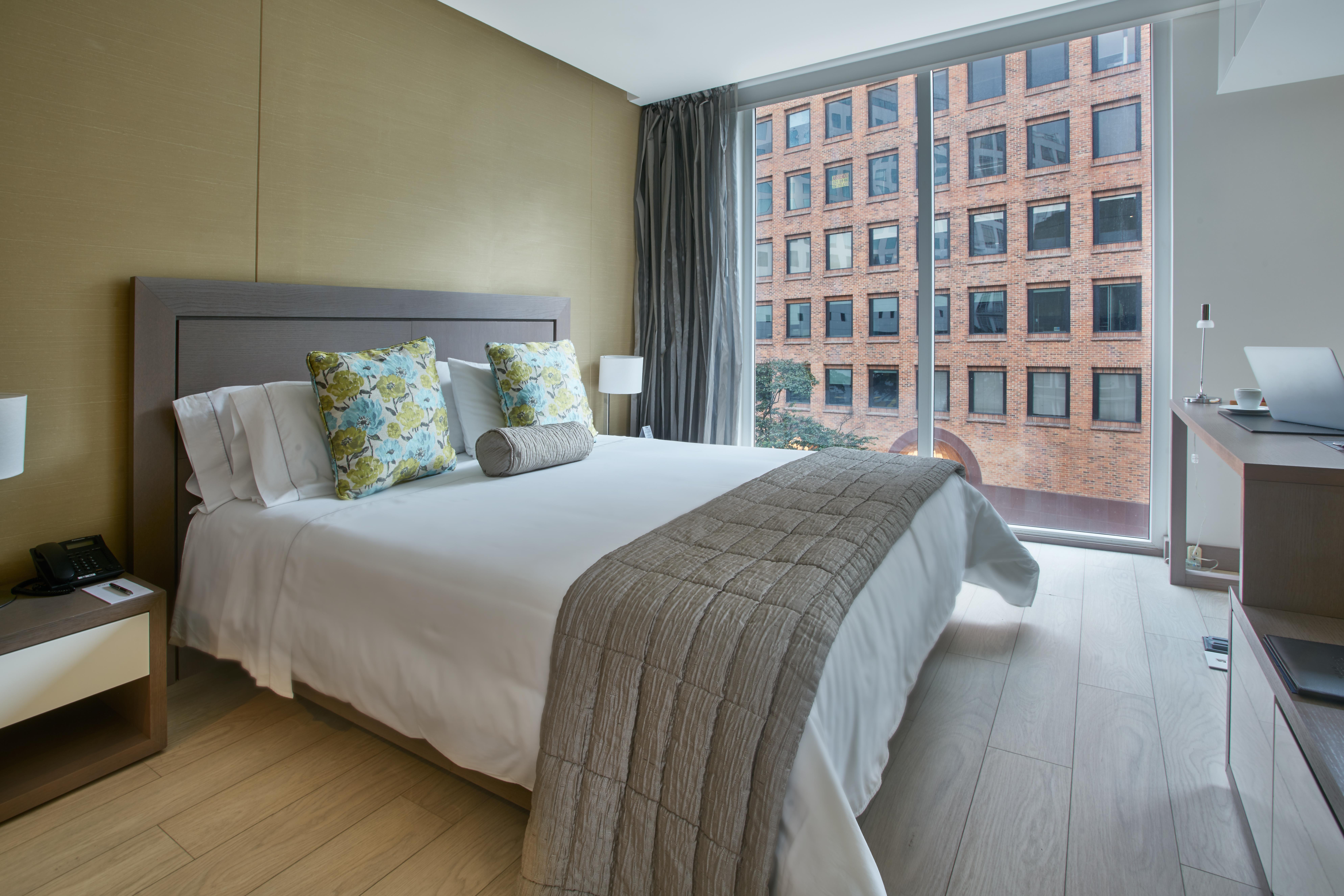 Hotel 100 Luxury Suites By Preferred Μπογκοτά Εξωτερικό φωτογραφία A bedroom at the hotel